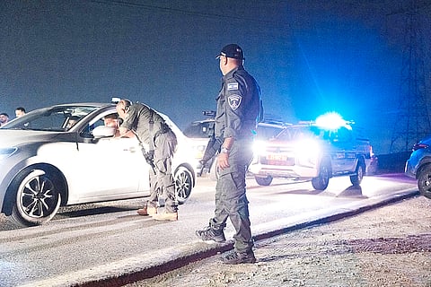 Israeli police secure the site of a drone strike near the northern Israeli town of Binyamina amid the continuing war between Israel and Hezbollah. An Israeli volunteer rescue service said more than 60 people were wounded south of Haifa, where Hezbollah earlier said it targeted a military base with drone strikes.