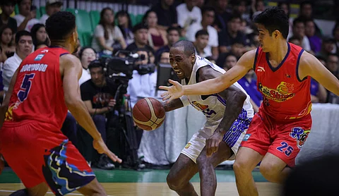 SANTI Santillan and Gabe Norwood of Rain or Shine make life difficult for TNT Tropang Giga import Rondae Hollis-Jefferson during Game 3 of their PBA Governors’ Cup best-of-seven semifinal series last Sunday.