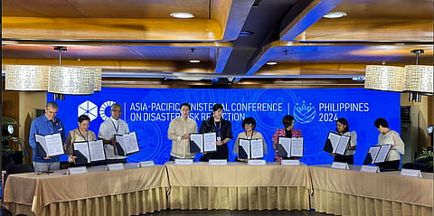 DENR Secretary Maria Antonia Yulo-Loyzaga signs a memorandum with the private and environmental sector led by SM Supermalls.