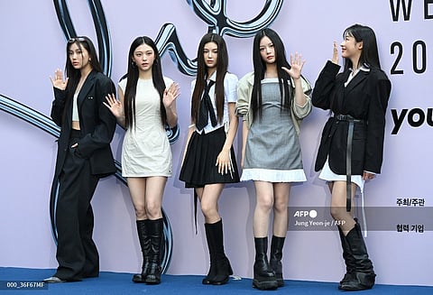 LOOK: K-pop girl group NewJeans members pose on the blue carpet at the 2025 Spring/Summer Seoul Fashion Week at Dongdaemun Design Plaza in Seoul on 3 September 2024. | Photo courtesy of AFP