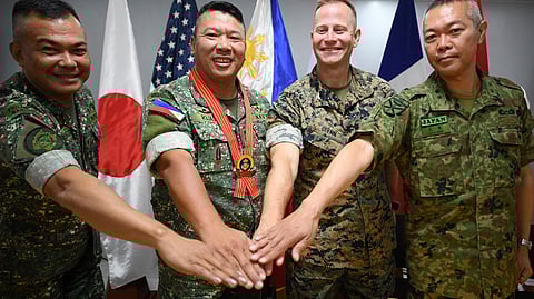 (L-R) Philippine Marine Corps and exercise director Brigadier General Vicente Blanco, Philippine Marine Corps commandant Major-General Arturo Rojas, US Marines exercise representative Colonel Stuart Glenn, and Japan's Ground Self-Defense Force Major-General Hajime Kitajima pose during a press conference after the opening ceremony of the Kamandag 2024 joint military exercise at the Philippine Marines officers club at Fort Bonifacio in Manila on 15 October 2024.