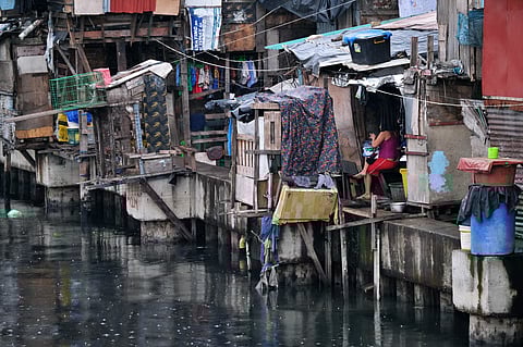 (FILE PHOTO) What is ‘poor’? Shanties like these at Estero de Vitas in Tondo, Manila are common sights in certain parts of the country, reminding us of various factors affecting quality of life.