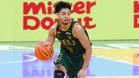 Jorick Bautista celebrates after leading the FEU Tamaraws to a 65-58 win over the NU Bulldogs in Season 87 UAAP men’s basketball tournament yesterday at the Mall of Asia Arena.