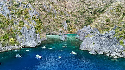 Escape to the tranquil beauty of Cadlao Lagoon, Palawan.