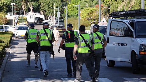 Israeli security forces gather on a street leading to the Prime Minister Benjamin Netanyahu's residence in Caesarea on 19 October 2024. Netanyahu's office said a drone was launched toward his residence on October 19, after the military reported a drone from Lebanon had "hit a structure" in the central Israeli town.