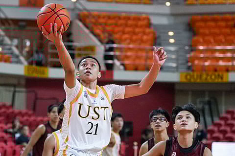 Jhon Canapi banners the UST Tiger Cubs to an impressive 90-59 win over the UPIS Junior Maroons in Season 87 UAAP juniors high school basketball tournament on Saturday.