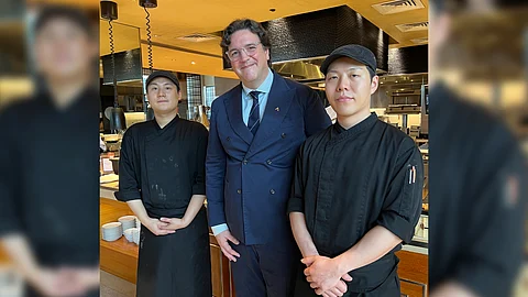Conrad Manila general manager Fabio Berto flanked by Korean chefs Jun Mok Lee (left) and Younghun Hwang (right).