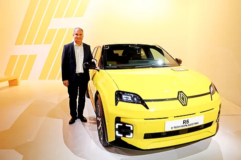 Renault Brand CEO Fabrice Cambolive poses next to a Renault 5 E-TECH Electric in the Paris suburb of Aubervilliers, giving a boost to the French automaker’s electrification plans.