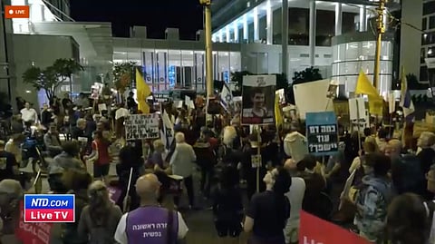 Protesters demonstrate outside Secretary of State Antony Blinken’s hotel in Tel Aviv demanding the release of hostages taken during Hamas’ 7 Oct. attack in Israel.