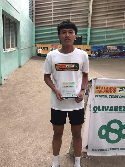 Marvin Plata lifts the trophy after beating Kraut Gavin, 6-2, 6-2, to rule the boys’ 16U division of the Rep. Edwin Olivarez National Junior Tennis Championships.