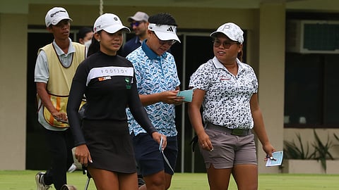 Daniella Uy and Sarah Ababa chat in between holes.