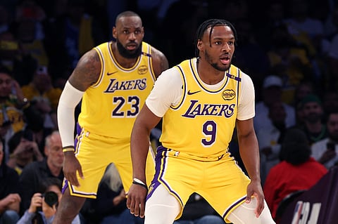 Lebron James and his son, Bronny, make history when they become the first father and son tandem to play an official game in the National Basketball Association.