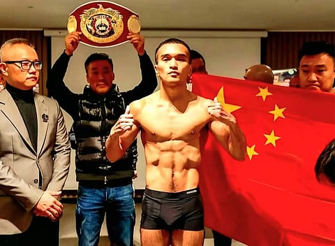Zhu Dianxing (middle) is making sure that crucial information regarding his training program will not be leaked to Pedro Taduran’s camp ahead of their IBF minimumweight title fight on 23 November in South Korea.