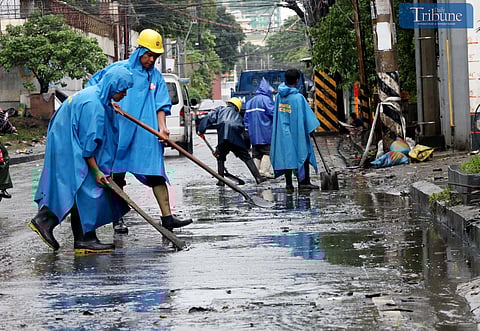 On Friday, 25 October 2024, MMDA personnel cleared debris and mud left by flooding from Tropical Storm Kristine at the corner of Araneta Avenue and Maria Clara Street in Quezon City.