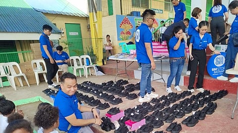 Aetas get free shoes from SM Bataan