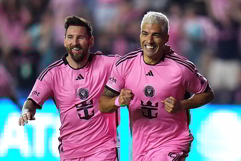 Luis Suárez of Inter Miami celebrates a goal with Lionel Messi during the first half against the Atlanta United during round one of the 2024 MLS Playoffs.