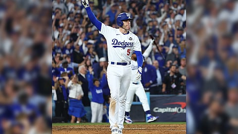 Freddie Freeman celebrates his walk-off grand slam that powered the Los Angeles Dodgers to a 6-3 victory over the New York Yankees in their World Series opener on Friday at Dodger Stadium.