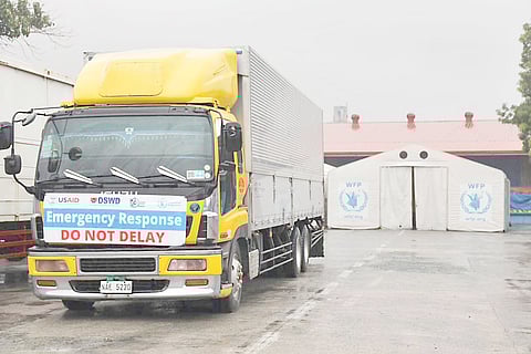 USAID truck loaded with food relief from the DSWD and World Food Program is off to Bicol.