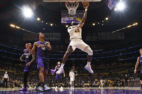Lebron James posts a triple double of 32 points, 14 rebounds and 10 assists to power the Los Angeles Lakers to a 131-127 win over the Sacramento Kings on Saturday in the NBA regular season.