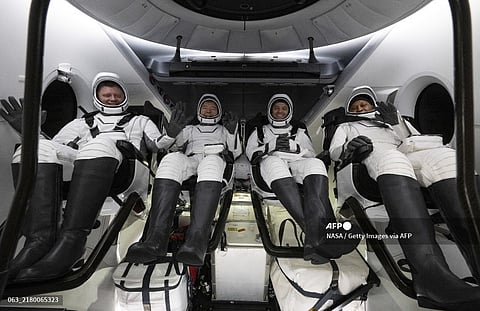 IN SPACE - OCTOBER 25: (EDITOR’S NOTE: This Handout image was provided by a third-party organization and may not adhere to Getty Images’ editorial policy.) In this NASA handout, Roscosmos cosmonaut Alexander Grebenkin (L) NASA astronauts Michael Barratt (2nd L) Matthew Dominick (2nd R) and Jeanette Epps (R) are seen inside the SpaceX Dragon Endeavour spacecraft onboard the SpaceX recovery ship MEGAN shortly after having landed in the Gulf of Mexico off the coast of Pensacola, Florida on October 25, 2024. Dominick, Barratt, Epps, Grebenkin are returning after seven-months in space as part of Expedition 70 aboard the International Space Station. Joel Kowsky/NASA via Getty Images/AFP