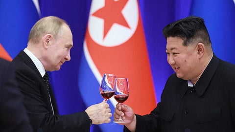 In this pool photograph distributed by the Russian state agency Sputnik, Russian President Vladimir Putin and North Korean leader Kim Jong Un toast during a reception at the Mongnangwan Reception House in Pyongyang on 19 June 2024. Putin enjoyed a red carpet welcome, a military ceremony, and an embrace from North Korea's Kim Jong Un during a state visit to Pyongyang where they both pledged to forge closer ties.