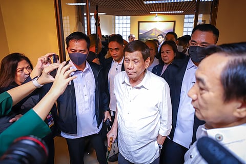 Former President Duterte arrives at the Senate plenary with a walking cane to attend the Senate Blue Ribbon Committee’s investigation into his controversial war on drugs, far from his once tough image that appealed to Filipino voters.