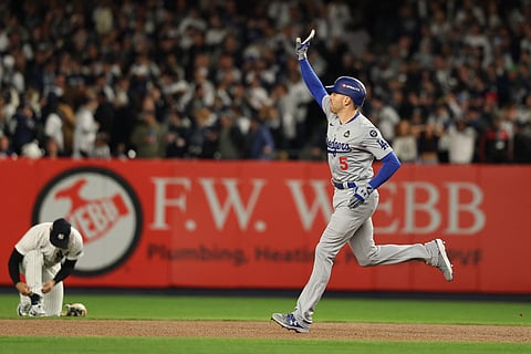 Freddie Freeman completes a home run that gives the Los Angeles Dodgers a 4-2 victory over the New York Yankees to move one win away from clinching the World Series.