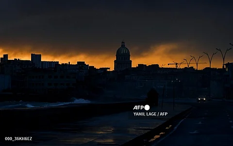 LOOK: View of the city at dawn during the fourth day of a massive power outage in Havana on 21 October 2024. Electricity has been restored to half of Havana, the Cuban capital's power company reported Monday, four days after the start of a nationwide power blackout that the authorities have struggled to fix. | Photo courtesy of YAMIL LAGE / AFP