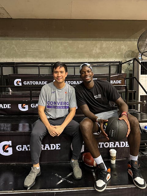 Converge assistant coach Charles Tiu (left) rolls out the red carpet for Cheick Diallo who will serve as their reinforcement in the PBA Governors’ Cup starting 27 November.