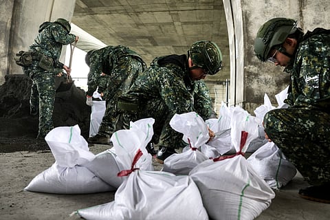 TAIWANESE military personnel prepare sandbags as typhoon ‘Kong-rey’ approaches Taiwan, in Yilan County.