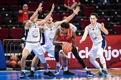 The Adamson defenders make life difficult for UE slotman Precious Momowei during their UAAP Season 87 men’s basketball game tournament on Wednesday. The Falcons prevailed, 45-37.