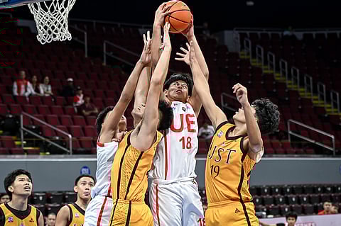 Gab delos Reyes (No. 18) of the UE Junior Warriors pulls down the rebound during their UAAP Season 87 junior high school basketball tournament on Wednesday. The Junior Warriors prevailed, 80-78.