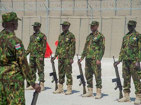 Kenyan police hold weapons at the Toussaint Louverture International Airport in Port-au-Prince, Haiti on September 21, 2024.
