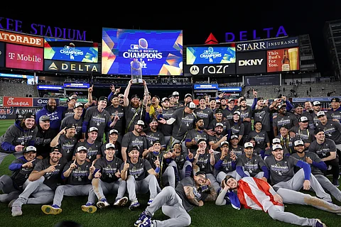 The Los Angeles Dodgers celebrate after posting a dramatic 7-6 victory over the New York Yankees to clinch the World Series.