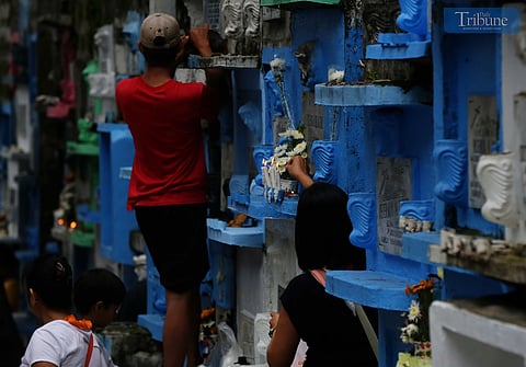 (October 31 2024)………..People visit their departed loved ones to offer candles, flowers, and pray at Barangka Public Cemetery in Marikina City, a day before the All Souls Day Celebration, on Thursday, October 31, 2024.………