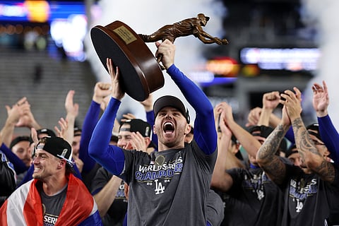 Freddie Freeman of the Los Angeles Dodgers lifts the trophy after emerging as Most Valuable Player of the World Series.