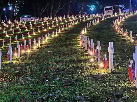 Rows of lighted candles honor the tombs of departed soldiers at the Libingan ng mga Bayani, Fort Bonifacio, Taguig City