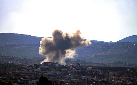 (FILE) A picture taken from the southern Lebanese city of Tyre shows smoke as it rises from the site of an Israeli airstrike on October 24, 2024.