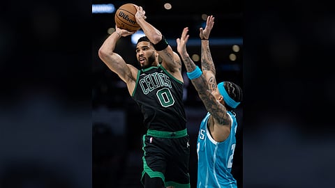 Jayson Tatum bangs in 32 points to power defending champion Boston to a 124-109 victory over the Charlotte Hornets on Friday in their NBA regular season game.