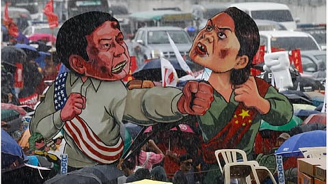 Cutouts of President Marcos and Vice President Duterte fighting