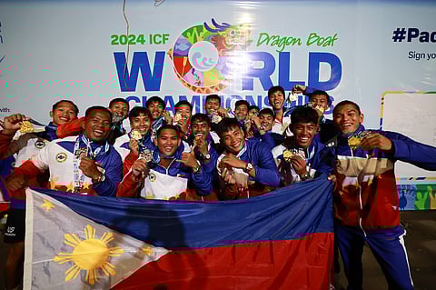 Members of Team Philippines flaunt their gold medals after emerging victorious in the mixed standard boat 200m event of the ICF Dragon Boat World Championships in Puerto Princesa City.