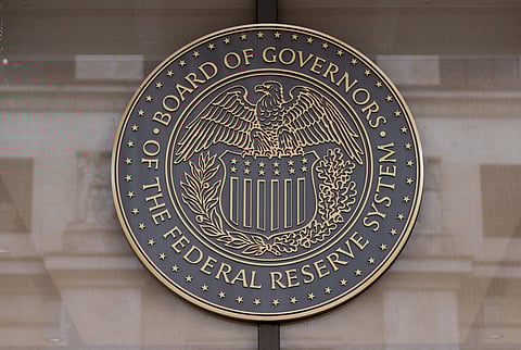 The US Federal Reserve emblem is seen in Washington, DC. The Fed’s preferred inflation indicator cooled further last month and now sits just above its long-term target, according to government data.