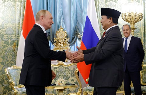 In this photo taken on July 31, 2024, Russia's President Vladimir Putin (L) welcomes Indonesia's then President-elect Prabowo Subianto at the Kremlin in Moscow.