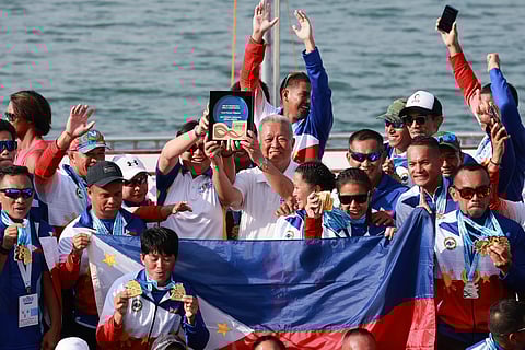 PUERTO Princesa City Mayor Lucilo Bayron (middle) celebrates with the national team that dominated the ICF Dragon Boat World Championships over the weekend in Puerto Princesa City.