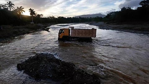A truck crosses an flooded river near the town of Imias in Guantanamo Province, Cuba, on October 30, 2024, more than a week after the passage of Hurricane Oscar.