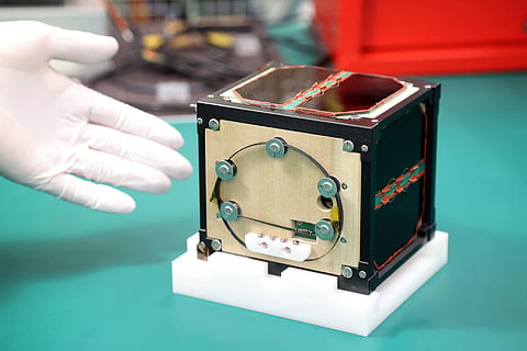 HISTORIC FIRST. This file photo taken on May 28, 2024 shows the world’s first satellite made from wood, named LignoSat, developed by scientists at Kyoto University and logging company Sumitomo Forestry, during a press conference in Kyoto. The world’s first wooden satellite has blasted off on a SpaceX rocket, its Japanese developers said on Nov. 5, 2024, part of an resupply mission to the International Space Station.