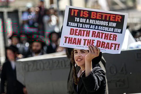 Israeli police officers intervene in Ultra-Orthodox Jews who gather to stage a protest against mandatory military service in West Jerusalem, Israel, on August 21, 2024.