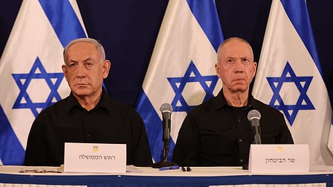 (FILES) Israeli Prime Minister Benjamin Netanyahu (L) and Defence Minister Yoav Gallant attend a press conference in the Kirya military base in Tel Aviv on 28 October 2023 amid ongoing battles between Israel and the Palestinian group Hamas. Israel's Prime Minister Benjamin Netanyahu on 5 November 2024, dismissed Defense Minister Yoav Gallant over a breakdown in trust during the Gaza war against Hamas, his office said.