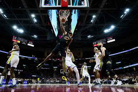 Evan Mobley #4 of the Cleveland Cavaliers dunks during the second half against the Golden State Warriors at Rocket Mortgage Fieldhouse on 8 November, 2024 in Cleveland, Ohio. The Cavaliers defeated the Warriors 136-117.