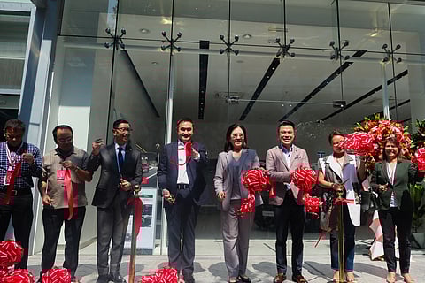 Going electric Tesla Philippines store manager Ian Rojas; Special Assistant to the President for Investment and Economic Affairs Secretary Frederick Go, Tesla regional director Isabel Fan and chief strategy officer of Megaworld Corporation Kevin Tan.